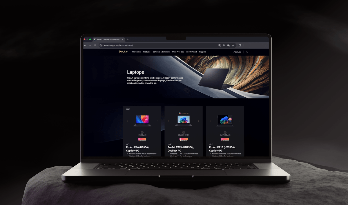 The redesigned ProArt laptops page, shown in a browser on a laptop in a dark studio scene.